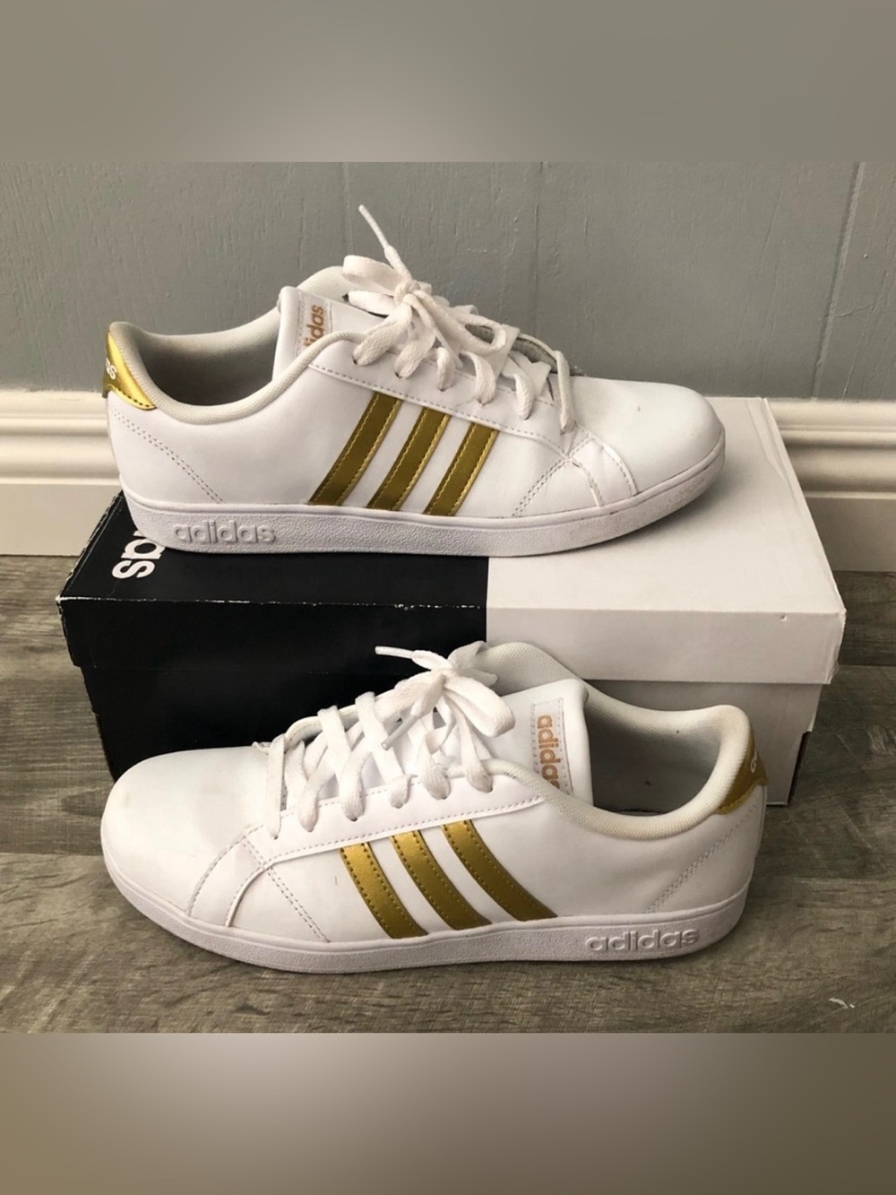 adidas Women’s White Sneakers with Gold Three Stripes